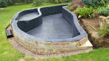 Vertical sided raised pond ideal for a fish pond